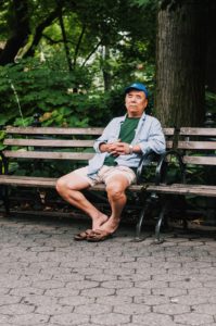 man resting on park bench