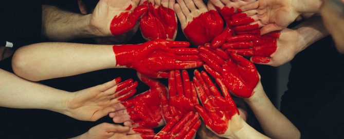 people's hands making a heart