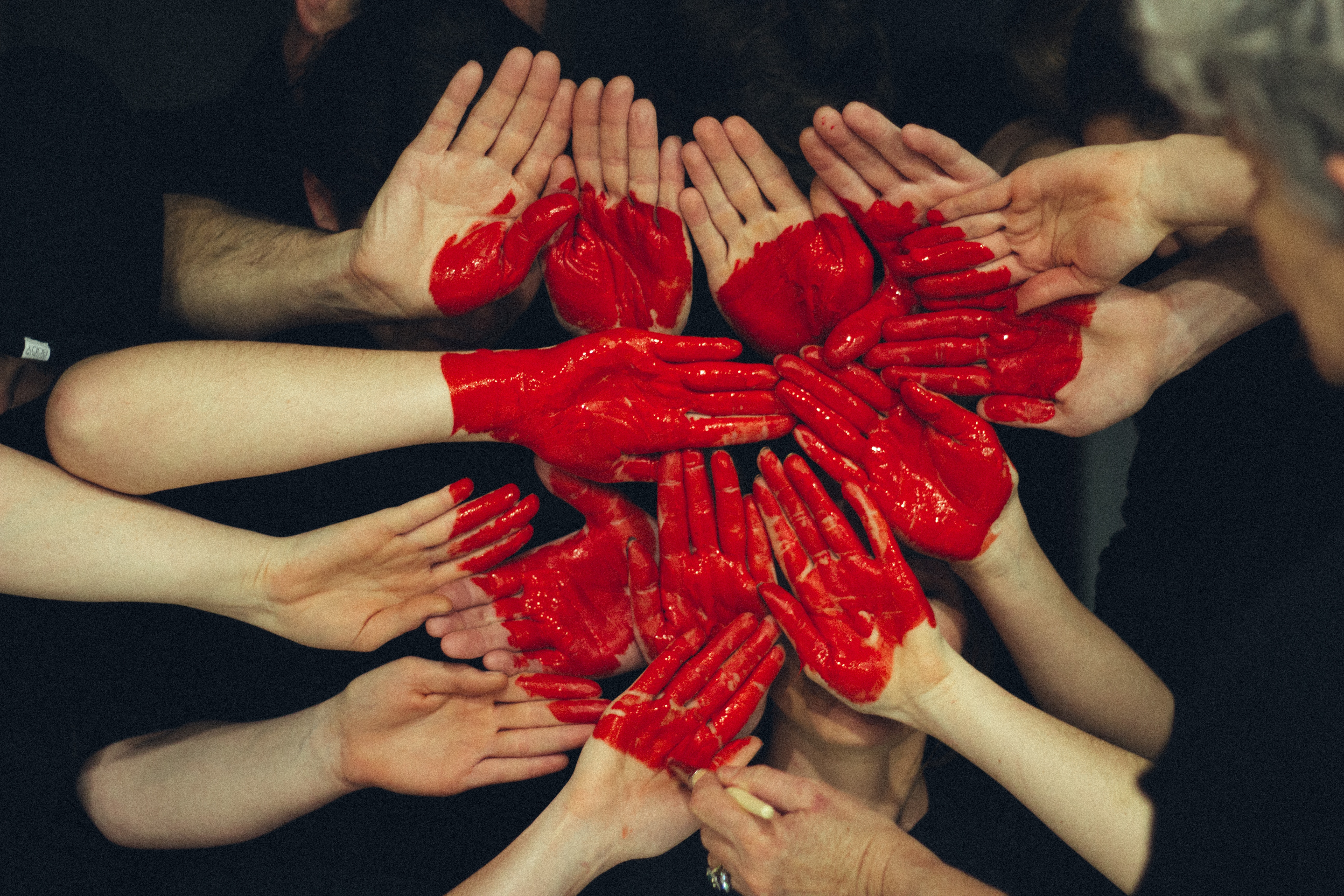 people's hands making a heart