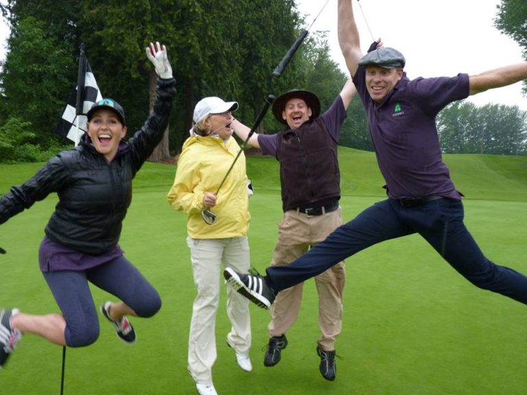 golfers jumping in the air