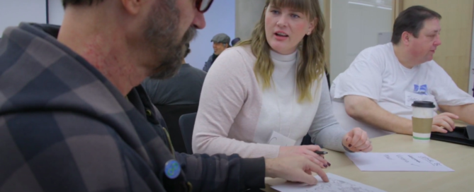 people talking at a table