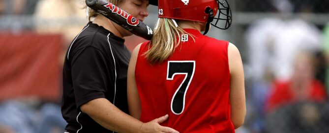 girl playing softball