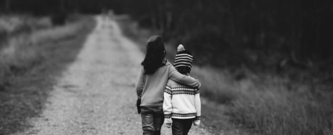 Children walking arm in arm