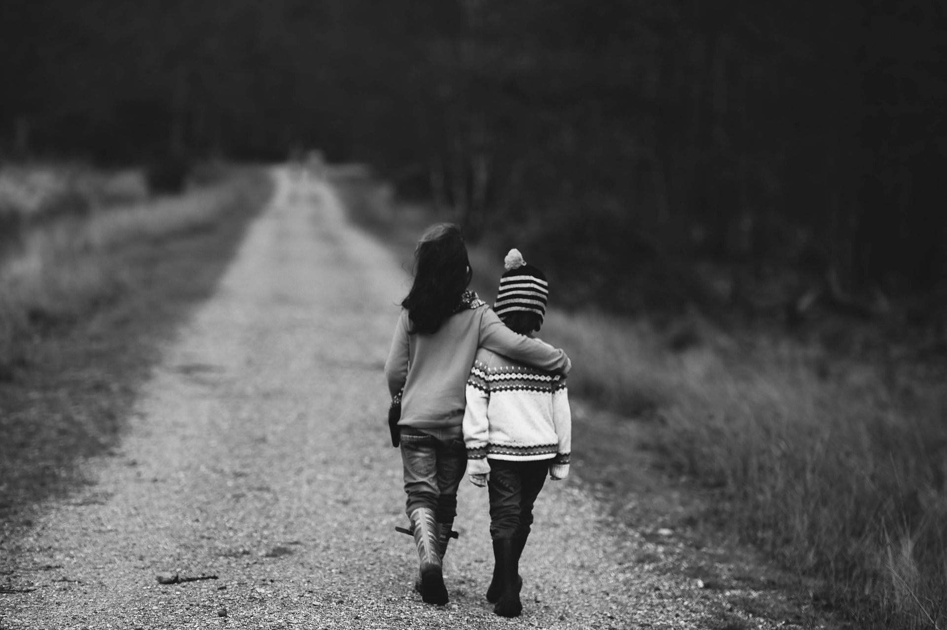 Children walking arm in arm